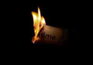 paper with time written on it burning